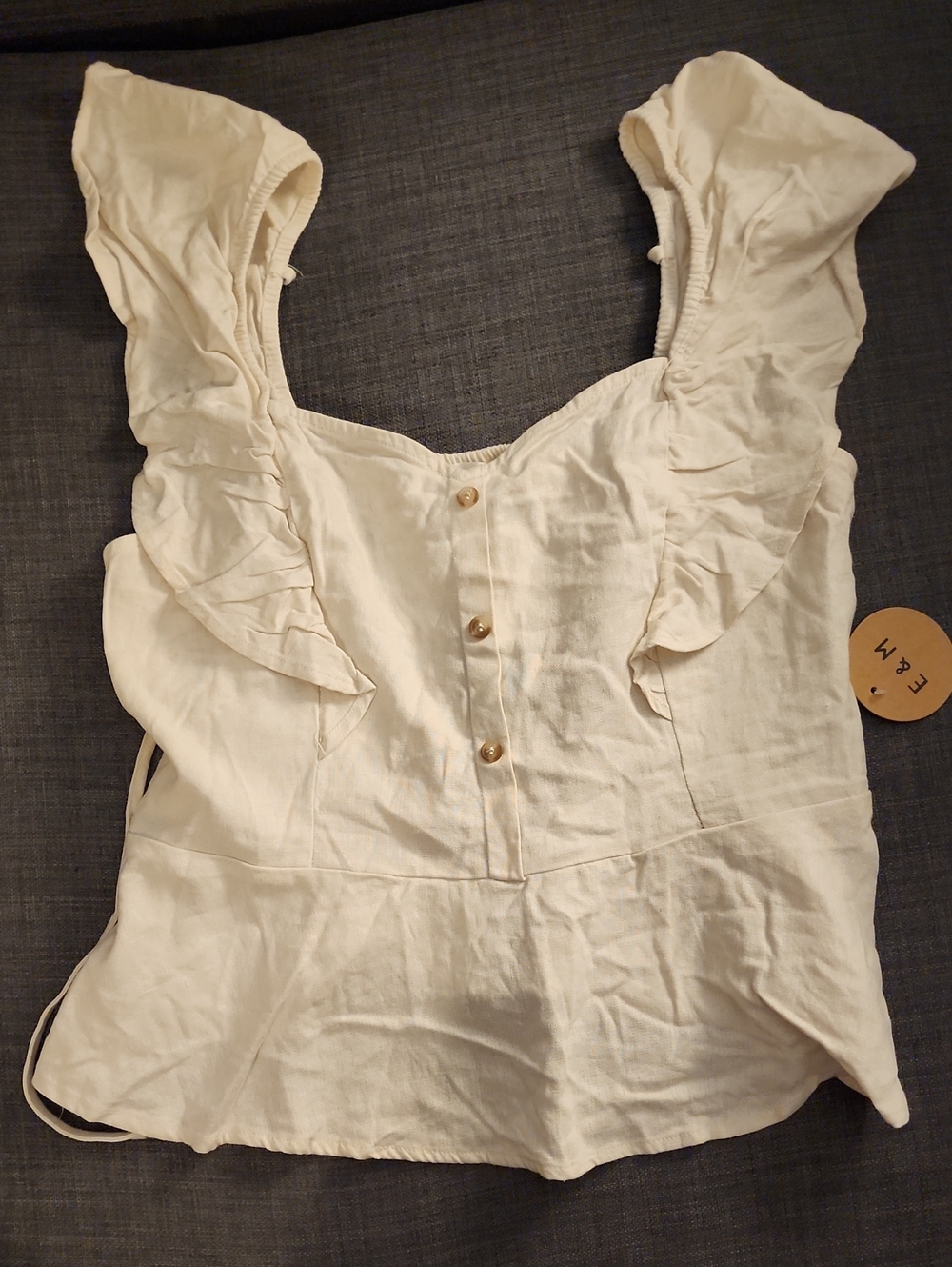 Sleeveless Ruffle Button-Front Blouse in Cream